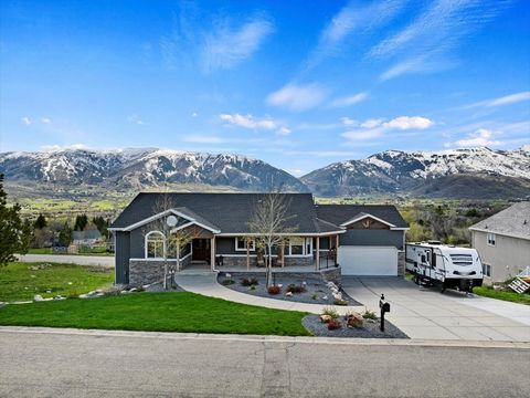 Welcome to your mountain retreat with unparalleled views of Nordic Valley Ski Resort! This fully updated home offers the perfect blend of luxury, comfort, and convenience, making it an ideal haven for both relaxation and entertainment. In the master ...
