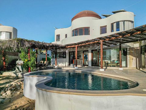 Welcome to the heart of the highly coveted Las Tunas Neighborhood in beautiful Todos Santos Baja California Sur Ideally placed on a spacious 1000m2 lot with dual street access this 2BD 2.5BA plus studio home designed by renowned architect Rafael Del ...
