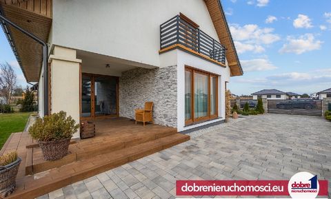 Offer exclusively with us. Good real estate recommends a modern, functional detached house with a double garage in the block, from 2019, charmingly located in a quiet estate in Łochów, one of the most dynamically developing towns in the suburbs of By...