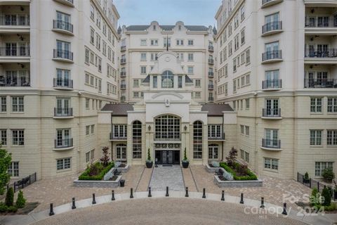 Absolutely stunning main level condo in coveted Rosewood at Providence. The epitome of luxury and opulence, this home offers a serene view of the lush grounds and provides ease of access via the welcoming lobby or via the private and exclusive ramp o...