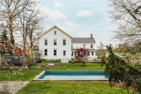 Discover Trumbull Farmhouse, a classic estate on a quiet country road just minutes outside of Hudson. Circa 1860, this heritage property boasts a spacious farmhouse, a guest cottage, and an original barn alongside a family-operated lavender farm with...