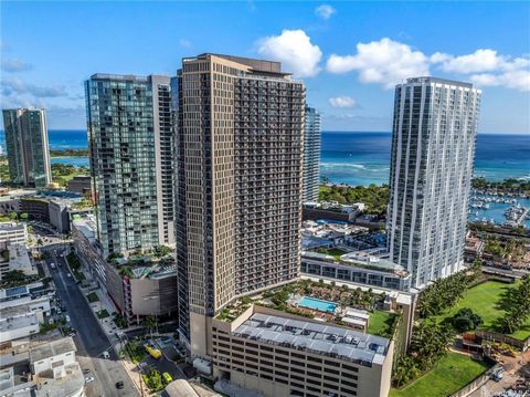 Fully Furnished, higher floor studio with mesmerizing view of the pool, spa, cabana, mountain, city, ocean and sunset views from your lanai! Super convenient location near Whole Foods, a variety of restaurants, shops and Ala Moana Beach! Aalii has a ...