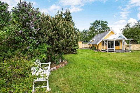 This holiday home is located by Hummingen, one of Lolland's most beautiful beaches. The cottage is furnished with an open kitchen with a fantastic light, two bedrooms and a bright living room with both access to a covered terrace and access to a larg...