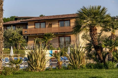 Directly on Lake Garda, on the edge of the Bay of Manerba: The apartments are located in a 30,000 sqm green area with direct access to the lake. The facility includes a spatially cleverly separated campsite with mobile homes. The municipality of Mane...