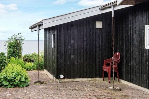 A traditional holiday cottage with a view of the sea from the house and the terrace. The house has a well equipped kitchen and a combined dining and living room, comfortably furnished and with a wood-burning stove, energy saving heat pump and direct ...