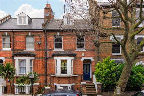 Indulge in urban living within this stylish three-bedroom, two-bathroom flat, spread across three levels of a charming mid-terrace property. Boasting 1517 square feet of thoughtfully designed space and a private garden, the apartment is nestled on Iv...