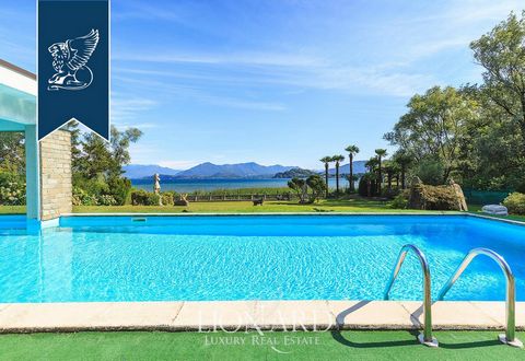 This luxury estate for sale is situated in the province of Varese, on the Lombard shores of Lake Maggiore. This luxury property was erected in the 1960s, sprawls over roughly 850 m² and encompasses two floors. The ground floor comprises a living area...
