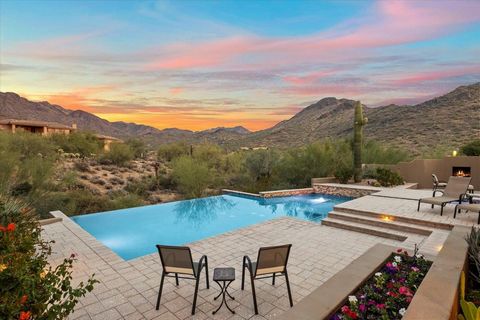 Nestled in the prestigious Canyon Heights neighborhood, this custom 5,919 square foot residence offers a luxurious and thoughtfully designed living space on a generous 2.199-acre lot, providing privacy and breathtaking panoramic views of the McDowell...