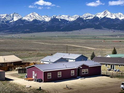 Escape to a 4-bed, 3-bath mountain retreat against the Sangre de Cristo mountains. Luxurious master suite, panoramic views on a 1/4 acre fenced lot. Spacious living, new carpet, wood-burning stove. Upgraded kitchen with stainless steel appliances. La...