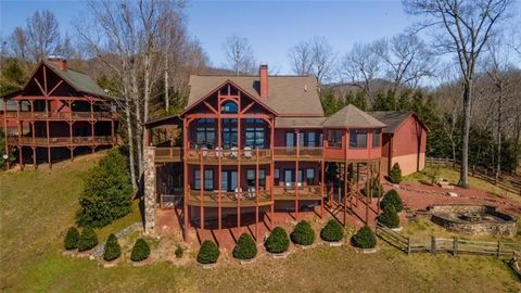 Exquisite Mountain Top Retreat Overlooking Lake Chatuge & Brasstown Bald! Welcome to an unparalleled living experience in this stunning 3-bedroom, 3-bathroom mountain top estate, offering 4,280 sq ft of luxurious space with a perfect blend of rustic ...
