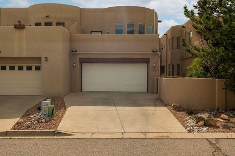 Exceptional Sandia Heights townhome. The spacious living area greets you with large windows that frame the Sandia Mountains. Lots of natural light throughout the home. The Primary bedroom located on the upper floor has a balcony with amazing views of...