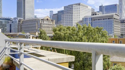 We present this stunning top-floor apartment with a larger-than-average balcony in desirable Rogers Court, Premiere Place, Canary Wharf, E14. The accommodation comprises a huge living space with views of the financial district and beyond. There are t...