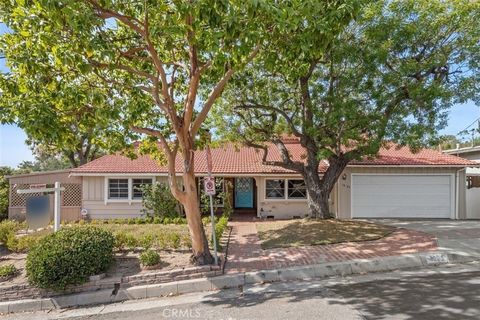 This captivating mid-century traditional home is nestled in the highly sought-after San Rafael Hills area of Pasadena, just steps away from the renowned 