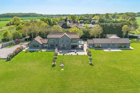 With a stunning interior and fabulous far reaching countryside views in The Rodings, this beautifully designed newly-constructed barn-style residence offers over 6,000 sq. ft., of accommodation offering contemporary luxury throughout, set within expa...