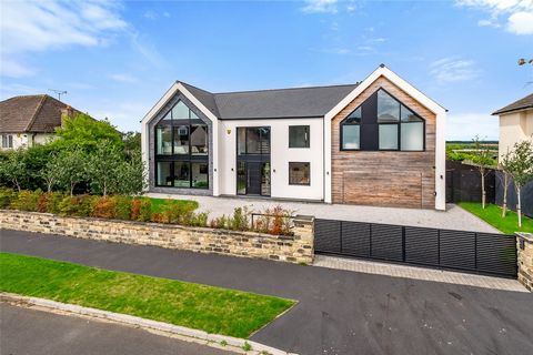 Boasting far reaching views over open countryside is this truly sensational and unique detached family home with a high specification finish throughout, providing arguably one of the finest examples of contemporary living within the highly sought aft...