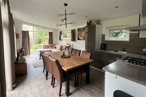 This detached, single-storey chalet is located in the conveniently located holiday park Resort Poort van Zeeland, 4.5 km from Rockanje and a stone's throw from a beach on the Haringvliet. The chalet has a stylish, modern look and is built in an L-sha...