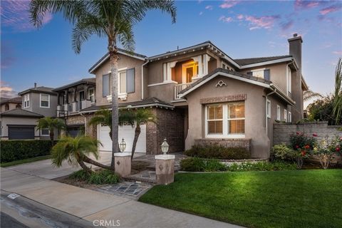 CITY LIGHT and SUNSET VIEW! Stunning Shea Homes-built residence with 5 bedrooms (3 are suites) plus loft plus mainfloor bonus area on end of cul de sac home site in Yorba Linda's popular Vista Del Verde neighborhood centered around Black Gold golf co...