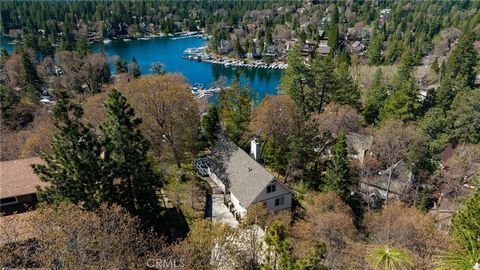 Lake Rights!! This is lake living at its finest with access to Lake Arrowhead provided with the purchase of the home. Rent or purchase a dock or store your boat at the marina and enjoy the gorgeous summers on the water. Nestled in the trees this ligh...