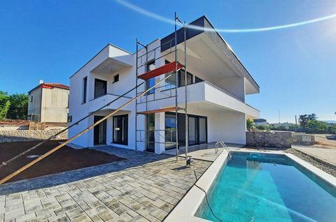 The island of Krk, Malinska, new semi-detached house surface area 160 m2 for sale, with pool and sea view. The house consists of ground floor with living room, kitchen, dining area, bathroom, hallway and terrace and the first floor with three bedroom...