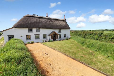 Gorrans Down is a three/ four-bedroom Grade II listed Devonshire thatched cottage dating back to the early 17th Century which sits in glorious rural countryside just outside the picturesque village of Hartland. Constructed out of traditional cob and ...