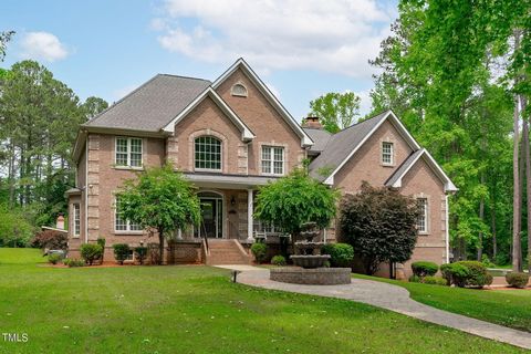 Custom-built, brick, basement estate on a secluded 4.33-acre gated compound with no HOA or city tax! This private oasis stands out among the Triangle's most impressive residences with immaculately maintained grounds featuring fruit bearing trees and ...