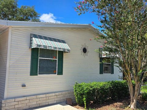 THIS PALM HARBOR 3/2 SPLIT PLAN FEATURES OVER 1300 SQ FT AND HAS BEEN WELL KEPT. THE FULLY EQUIPPED KITCHEN HAS WHITE APPLIANCES INCLUDING A 3 DOOR FRIDGE, SMOOTH TOP RANGE AND NEW DISPOSAL. THE FLOORS ARE HARD SURFACED WITH TILE AND VINYL PLANK. ONE...