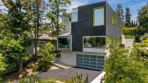 Distinguished by craftsmanship and quality, this rare Los Feliz contemporary home has been meticulously designed, blending indoor and outdoor living with city views. Nestled on a quiet tree-lined street at the base of the famed Griffith Observatory, ...