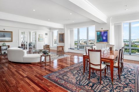 Beautifully renovated corner 4 bedroom home with exquisite appointments throughout including mahogany hardwood floors, crown moldings, custom California Closets, designer lighting & automatic Hunter Douglas shades. Marble tiled entry foyer opens to t...