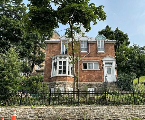 One block from St. Denis Avenue (the highest street in Quebec City), is a 124-year-old brick house, built in 1899 (double brick) with a metal roof. The house was originally built for the principal of the first English-language high school in Quebec C...