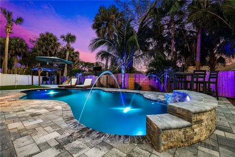 Offering $5k buyer credit! Encompassing the ultimate Floridian lifestyle and the entertainers dream with a brand new, top of the line backyard oasis featuring a 3 hole putting green, heated lagoon style pool, custom landscape lighting and hurricane r...