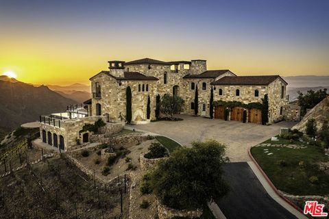 Welcome to Malibu Rocky Oaks, a landmark vineyard estate situated on over 37 acres of verdant rolling hills and terraces in the heart of Malibu wine country. This remarkable estate is situated behind grand custom iron gates, up a wide apx. 350 foot l...