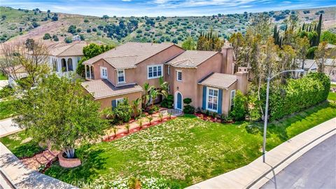 Discover unparalleled luxury in this exquisite 6-bedroom, 5.5-bathroom residence nestled in a tranquil cul-de-sac within the prestigious 24-hour guard-gated community of Mont Calabasas. Spanning 5,147 sq. ft., this home impresses with its soaring cei...
