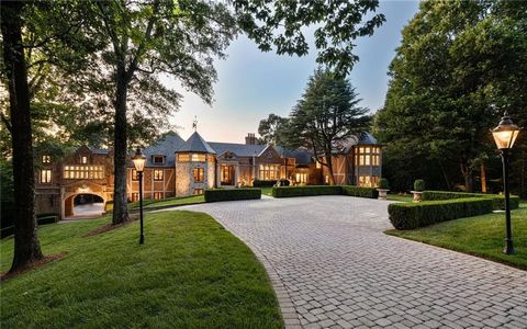 Majestic gates open to showcase a 17,000 square foot limestone and brick European inspired mansion that is strategically perched in the middle of the very private 18-acre property. The stunning architectural detail of the home exudes unparalleled gra...