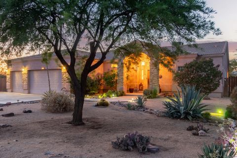 Enjoy country living in this well-built, beautiful, and well-maintained custom home on 1.29 acres with mountain views. Relax on the covered patio overlooking the vast yard with grass, cacti, lemon, orange, tangelo, and grapefruit trees. Travertine fl...