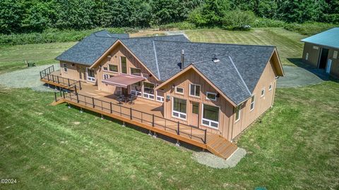 ACREAGE, BIG ROCK CREEK! This spacious home offers 3 en suites with main level living, open floor plan and gorgeous views from every window. Owner just installed a top of the line custom deck with awning, an electric gate w/ keypad, lights & cameras ...