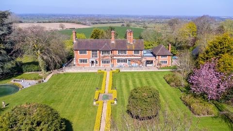Ground Floor The home is entered via ornate wooden doors leading into a storm porch and then into a fabulous hallway with stone flagstone floors and the ornate main staircase rising to the first floor. The home features stone mullioned windows with l...