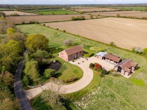 This detached converted barn with a separate annexe stands in 4.4 acres. With stunning views across spectacular Norfolk countryside and the blend of authentic character, modern comfort, and the idyllic setting directly adjoining Foxley Wood, Norfolk’...
