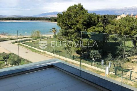 On the island of Pag, in the village of Povljana, there is a beautiful two-story apartment, first row by the sea, with an area of 112 m2. The first floor consists of a bedroom, bathroom, open concept kitchen, dining room and living room and a balcony...