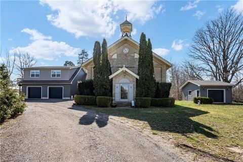 Nestled along 25235 Nairn Road, just shy of an acre, stands a piece of history intertwined with luxuryâthe former 1870 schoolhouse, now a meticulously transformed residence with a oversized garage and shop! This charming structure underwent a signifi...
