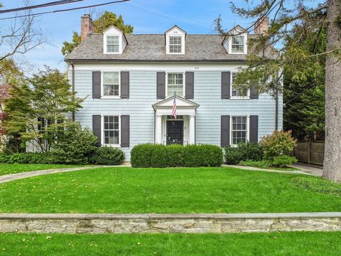 Welcome to this exquisite Bronxville Colonial residence, where elegance seamlessly merges with functionality. Nestled on a sprawling, level lot adorned with mature plantings, this home offers a luxurious haven just a stone's throw away from Bronxvill...