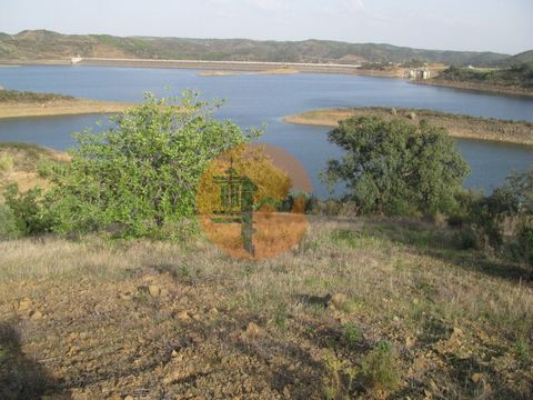 Rustic land with 27,600 m2, in Alcarias Grandes - Azinhal - Castro Marim - Algarve. The land borders the Beliche Dam. Next to the water. The land has some trees: fig trees, almond trees, carob trees, olive trees and cork oaks. The property has topogr...