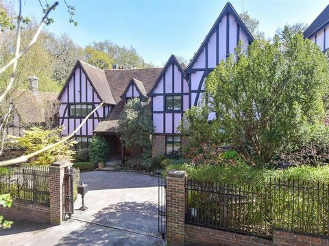 About this property   This Tudor style detached house oozes style and quality. It is approached through imposing wrought iron gates, flanked by brick pillars, that open onto a spacious driveway surrounded by trees and shrub beds and leads to the doub...