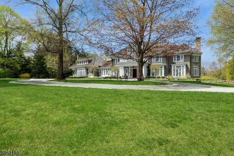 Surrounded by nature, this 22-room custom built estate with 5 bedrooms, 6 full and 4 half baths is a welcoming oasis. From first glimpse, a discerning buyer will be impressed with the architectural features and attention to detail in this elegant hom...