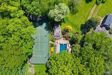 Rare Find in Prestigious Alpine... Land With Benefits! Two Fabulous Private Acres Of Gorgeous Landscaped Property With Huge Circular Driveway For 8+ Cars, Inground Heated Gunite Pool With Spa and Cabana, Newly Resurfaced Fully Lit Tennis Court, Handb...