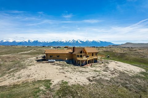Experience the tranquility of country living! With its private setting and panoramic mountain views, this 4-bedroom, 2.5-bathroom log home invites you to unwind and recharge on this 60+/- acre paradise! Enjoy your morning coffee while being serenaded...
