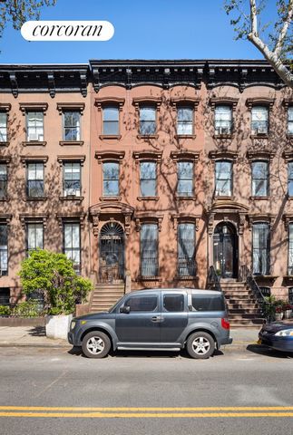Step back in time, live large, and seize the opportunity to own a piece of Brooklyn's remarkable history for a great price with this spacious, wide, and light-filled Fort Greene brick townhouse. Nestled in one of the borough's most coveted leafy-gree...