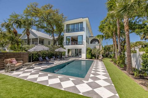 Absolutely beautiful, newly built Each Beach oceanfront home with saltwater pool, ideal for entertaining friends or hosting large family gatherings. Enter through a welcoming veranda that opens to a poolside entertainment room and covered patio overl...