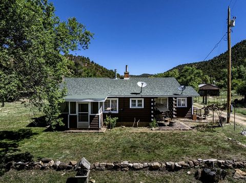 ***No HOA and NO Covanents!^^^ **Borders BLM** Welcome to your dream mountain retreat! This charming 1950s log cabin is now available for the first time ever. Featuring 2 bedrooms and 1 bath, this cozy cabin is perfect for those seeking a peaceful an...
