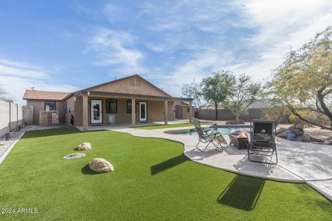 This beautifully remodeled horse property sits on a meticulously manicured one-acre lot with breathtaking mountain views. The exterior boasts a fenced front yard, artificial turf in the front and back, a pebble tech pool with a water feature and Kool...