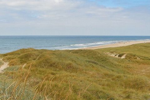 Holiday cottage, extended and modernised in 2007 with bathroom and large mezzanine. Located on 1250 m² natural/dune plot approx. 200 m from the North Sea and the large beach. The house is well-equipped with a cosy decor, 2 bedrooms, bathroom with sho...